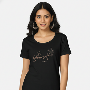 Woman wearing a black t-shirt with 'Be Yourself' text on a white background