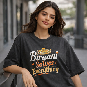 Woman wearing a black t-shirt with 'Biryani Solves Everything' text and graphic.