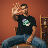 No Thoughts Just Vibes black regular fit graphic t-shirt for men and women - Trendble, sitting on a chair against an orange wall.

 - View 1
